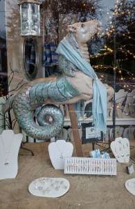 carved hippocampus in shop window
